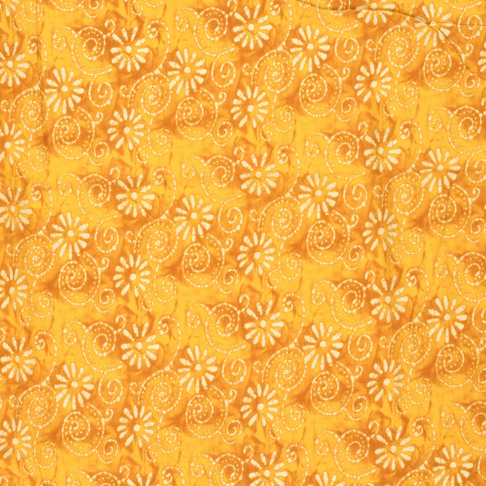 Bavlněný voál žlutý batikovaný Kytky